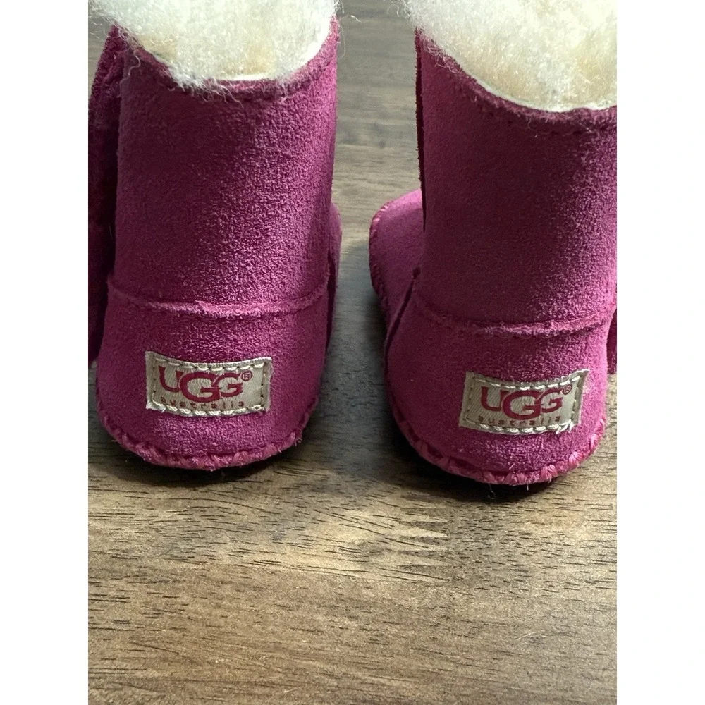 UGG Caden baby booties in fuchsia pink suede with sheepskin lining 0/1